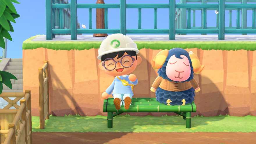 In-game screenshot of me in Animal Crossing sitting on a bench next to a napping Eunice.
